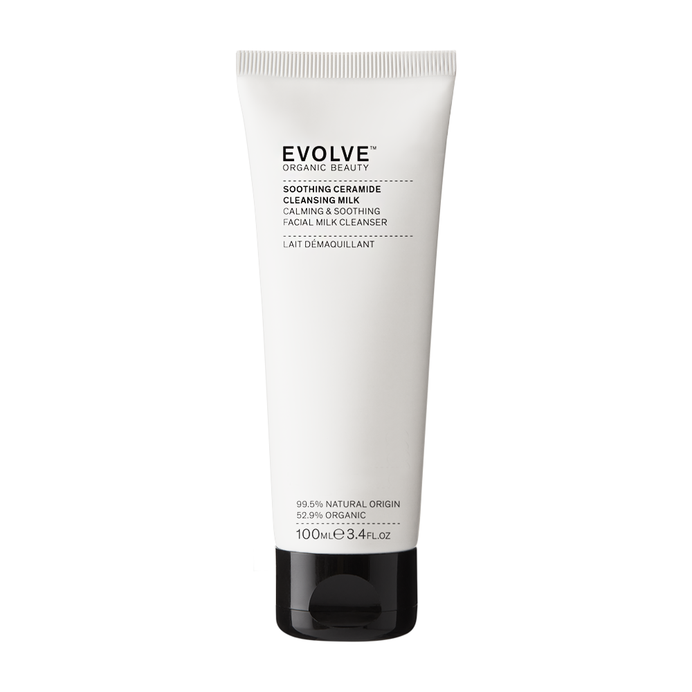 A 100ml white squeeze tube of EVOLVE Organic Beauty Soothing Ceramide Cleansing Milk with a black cap, centered on a plain white background.
