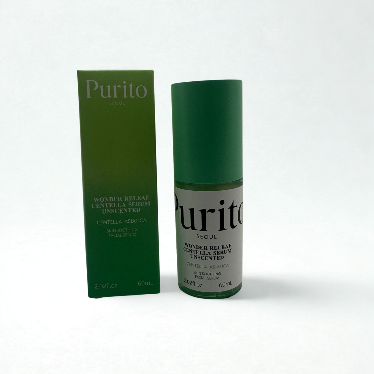 Purito Seoul Wonder Relief Centella Serum Unscented shown with its green outer box and a matching green-and-white cylindrical bottle on a plain white background. Label reads: Skin soothing facial serum.