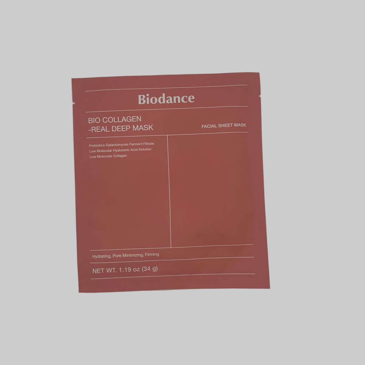A single square sheet mask packet from Biodance Bio Collagen -Real Deep Mask, in a muted terracotta red color, photographed flat against a light gray background.